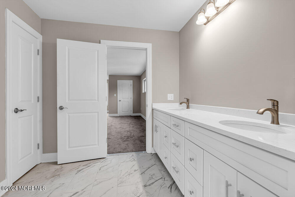 12 Sander Way Bayville, NJ 08721 - Photo 56 of 71 a spacious bathroom with a double vanity sink and a mirror