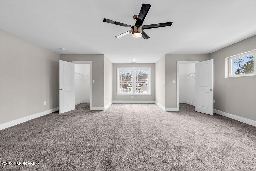 12 Sander Way Bayville, NJ 08721 - Photo 60 of 71 a view of a livingroom with a ceiling fan and window