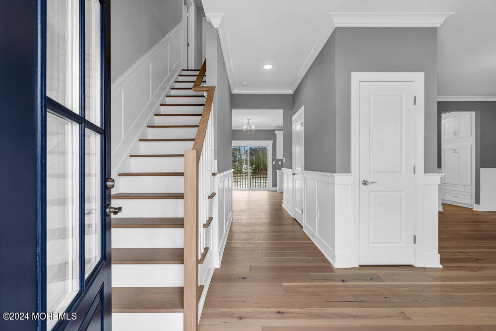 12 Sander Way Bayville, NJ 08721 - Photo 6 of 71 a view of a hallway with wooden floor and windows