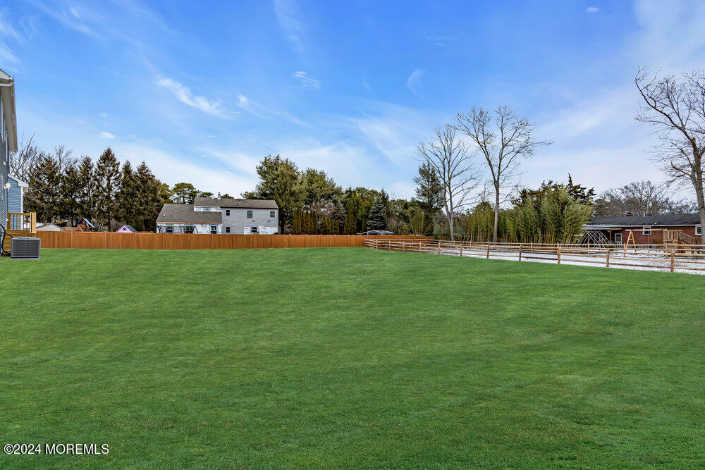 12 Sander Way Bayville, NJ 08721 - Photo 69 of 71 a view of yard with grass & palm trees