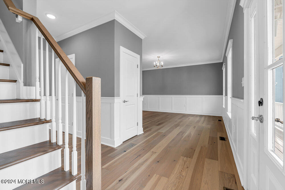 12 Sander Way Bayville, NJ 08721 - Photo 8 of 71 a view of a hallway view with wooden floor and staircase