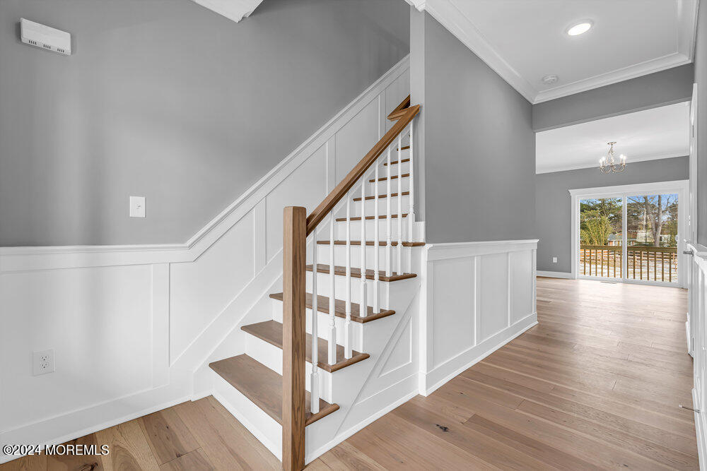 12 Sander Way Bayville, NJ 08721 - Photo 9 of 71 a view of staircase with wooden floor and white walls