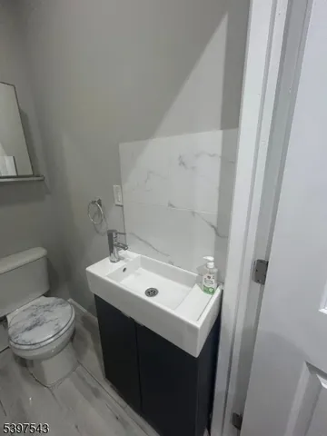 a bathroom with a sink toilet and vanity