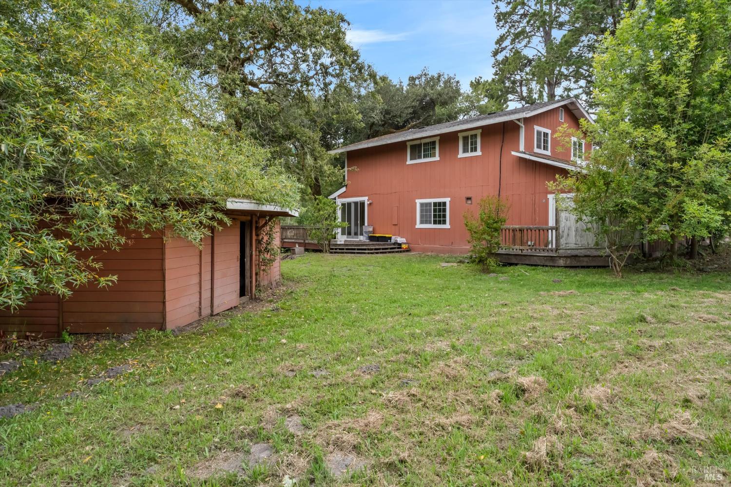 8157 Mill Station Road Sebastopol, CA 95472 - Photo 25 of 27 a view of a house with backyard and garden