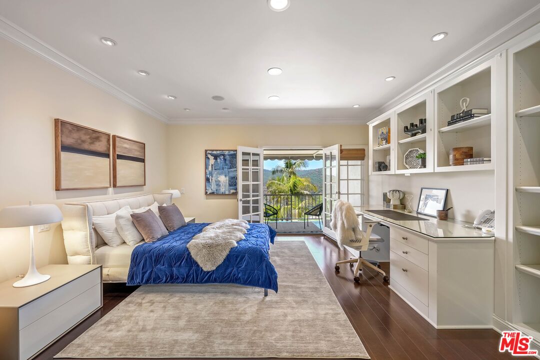 2305 Canyonback Road Los Angeles, CA 90049 - Photo 29 of 50 a spacious bedroom with a large bed and a couch