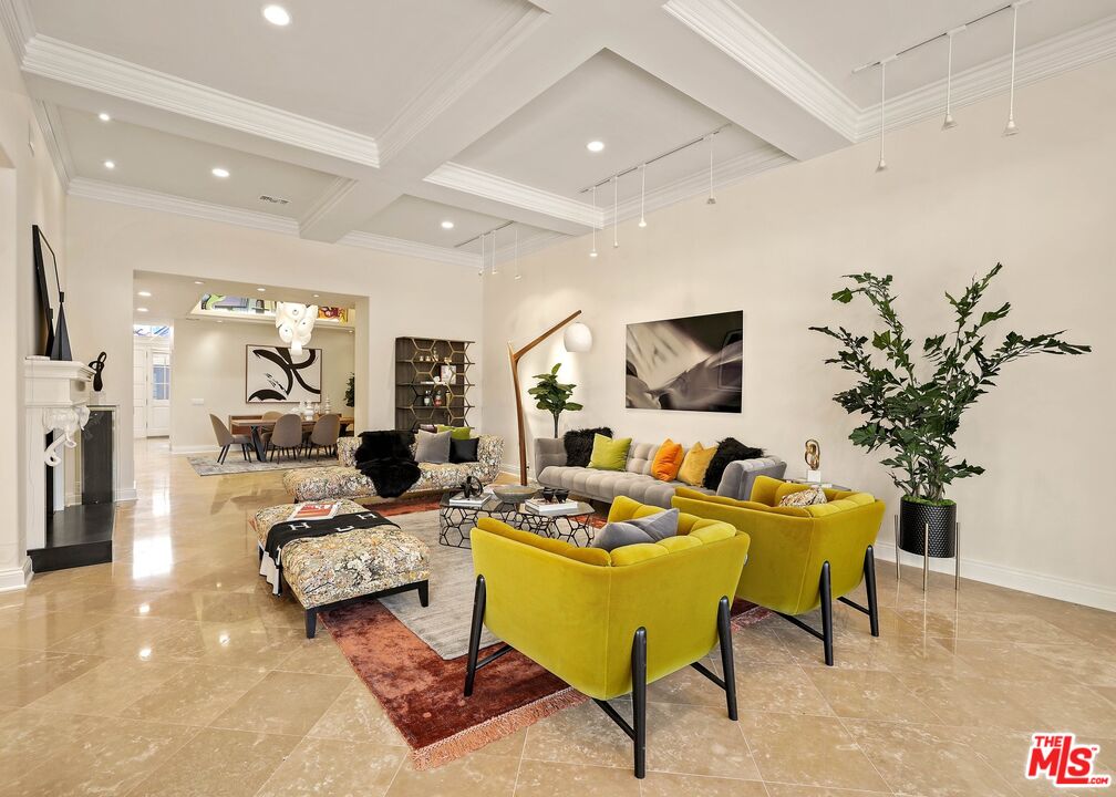 2305 Canyonback Road Los Angeles, CA 90049 - Photo 10 of 50 a living room with furniture fireplace and a flat screen tv