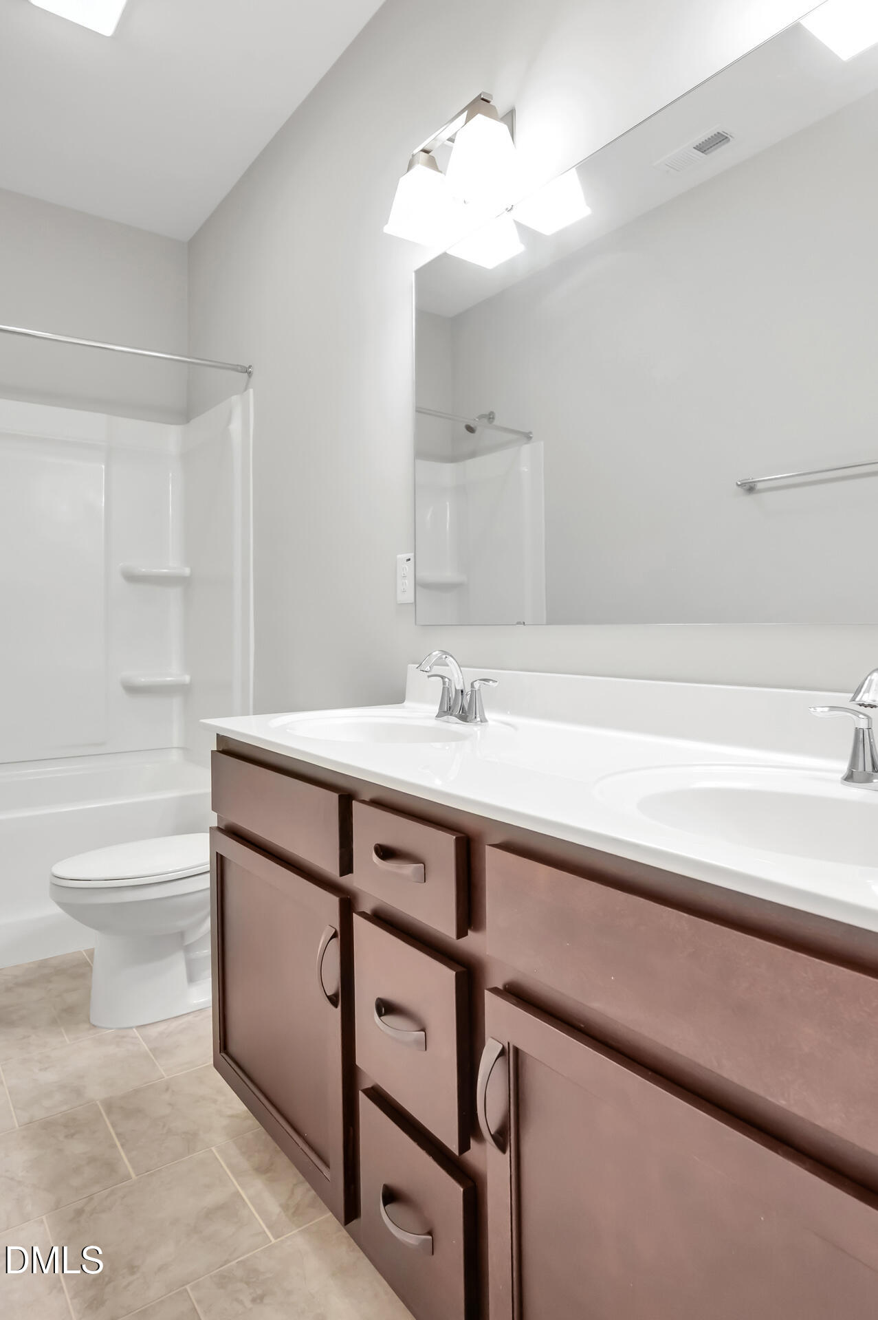 5406 Ripplebrook Drive Durham, NC 27712 - Photo 31 of 37 a bathroom with a sink a toilet and bathtub
