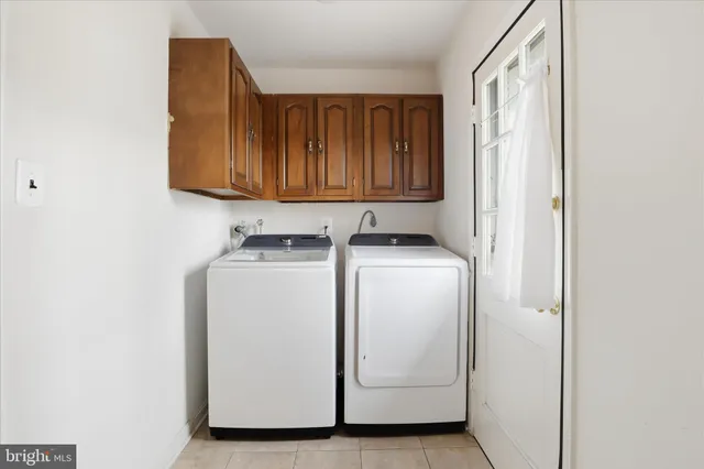 a view of storage and utility room with washer and dryer