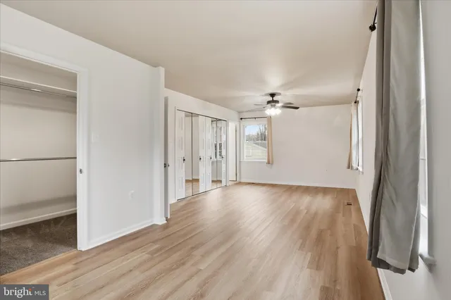 a view of a livingroom with wooden floor