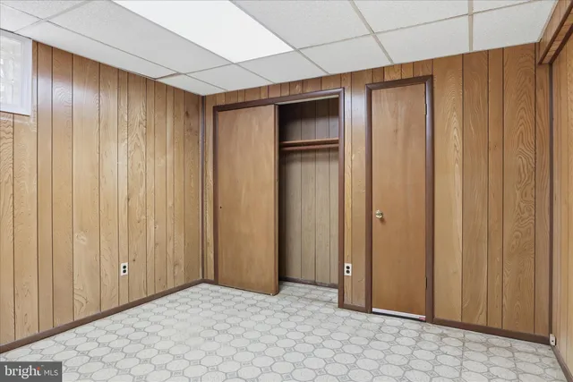 a view of entryway with wooden walls