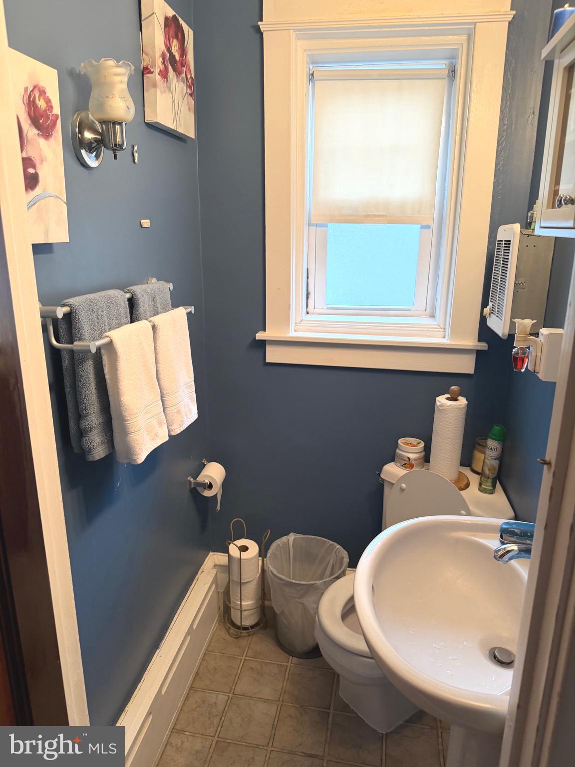 463 Burmont Road Drexel Hill, PA 19026 - Photo 18 of 39 a bathroom with a toilet sink and mirror