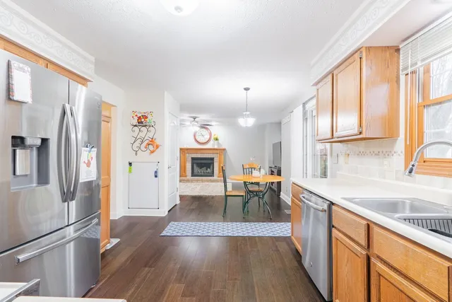 a bathroom with a sink vanity mirror and toilet