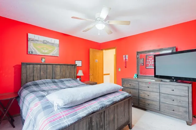 a bedroom with a bed and window