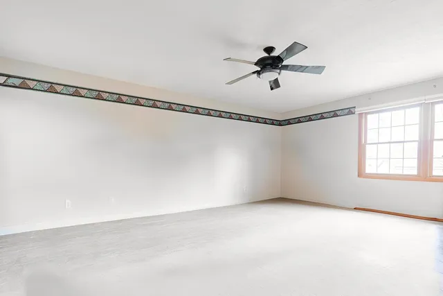 a view of a livingroom with furniture and a potted plant