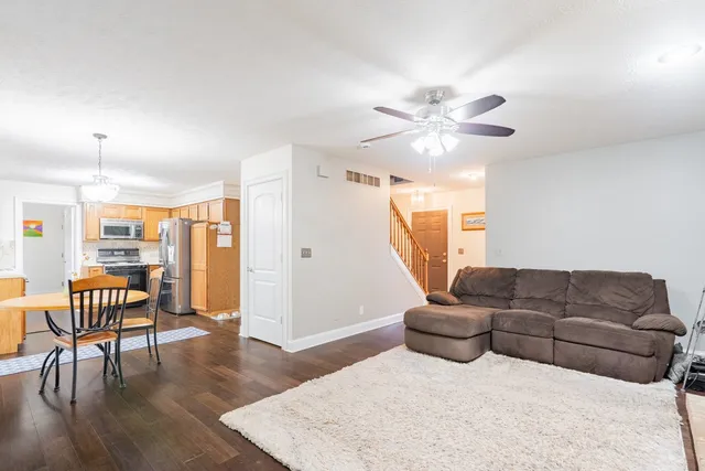 a kitchen with stainless steel appliances a refrigerator sink and microwave