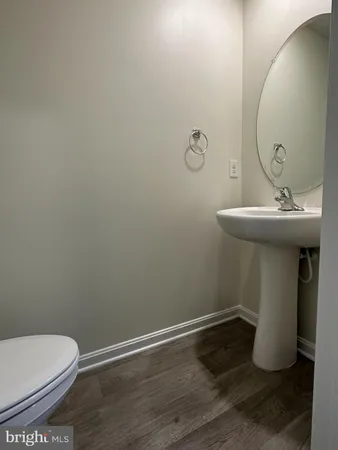 a bathroom with a sink and mirror