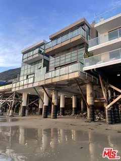 a view of balcony with furniture