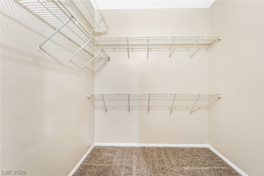 2050 West Warm Springs Road, Unit 2411 Henderson, NV 89014 - Photo 19 of 37 Organized wire shelving units provide ample storage within this practical walk-in closet.