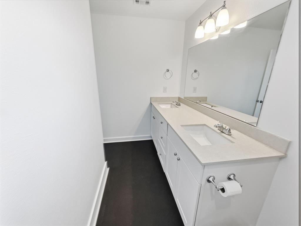 109 James Street, Unit 200 Decatur, TX 76234 - Photo 18 of 21 a bathroom with a sink and a mirror