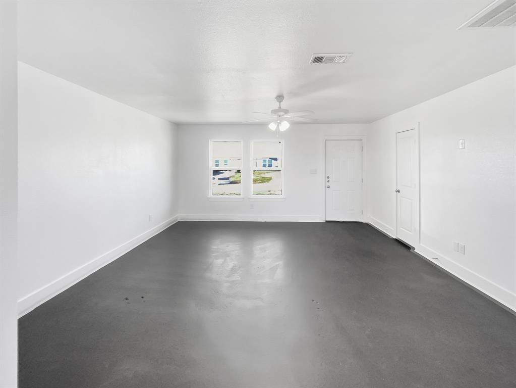 109 James Street, Unit 200 Decatur, TX 76234 - Photo 2 of 21 an empty room with a empty space and windows