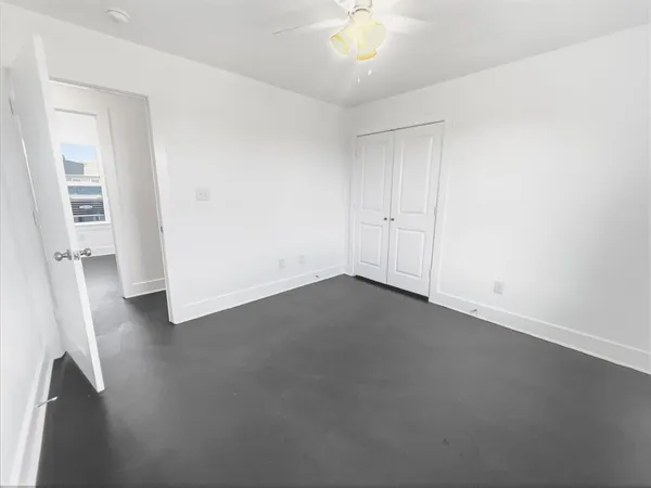 a bathroom with a white toilet sitting next to a bathroom sink and a shower
