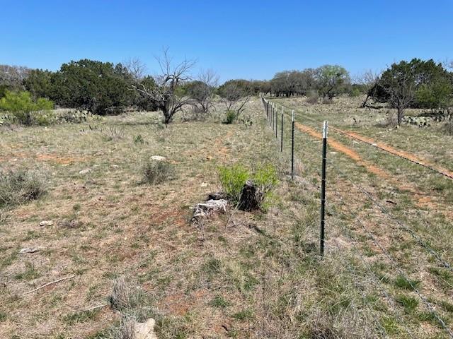 0 Tres Chivos Viejos Road Mason, TX 76856 - Photo 7 of 8 a view of a dry yard with wooden fence