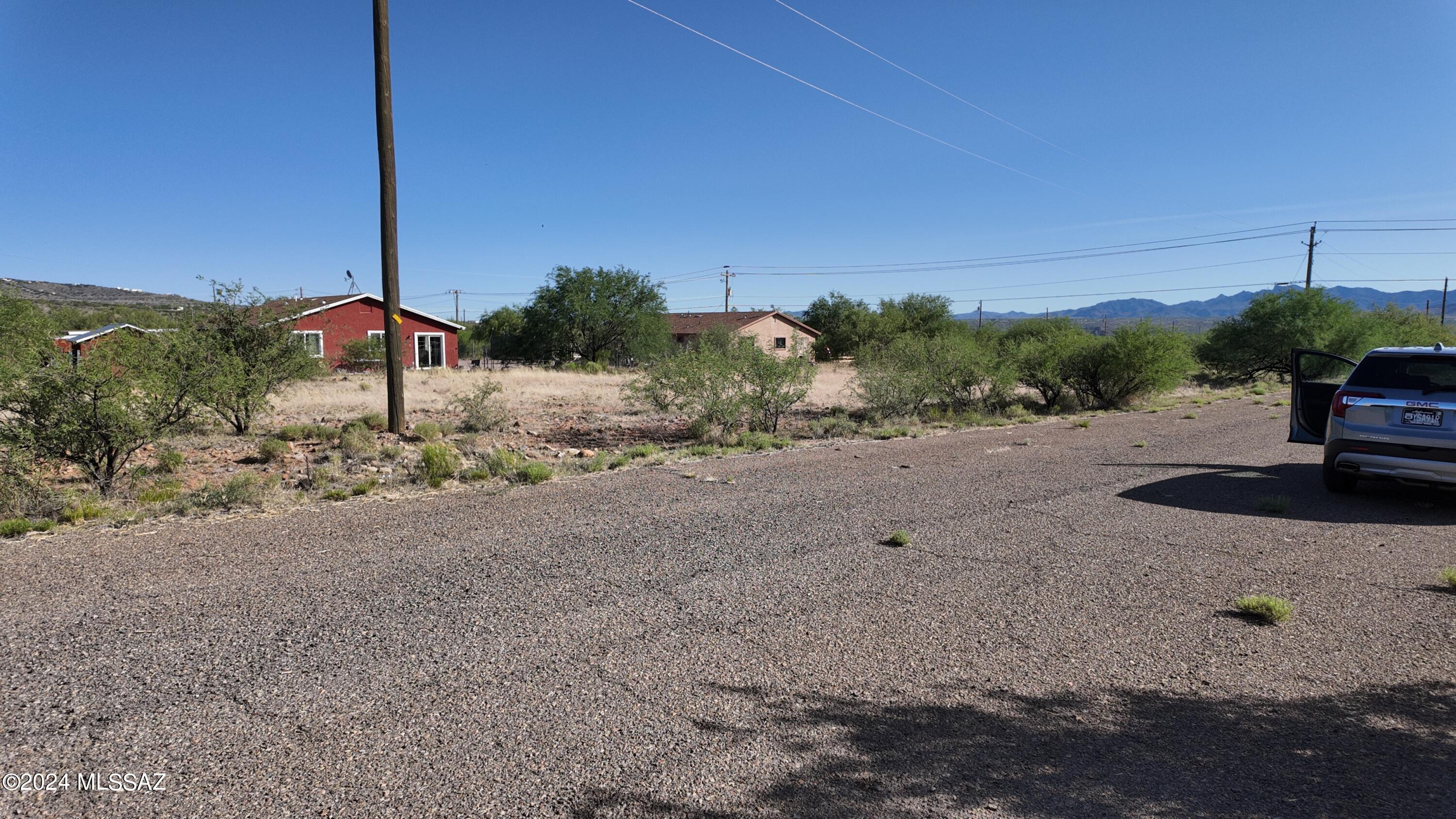 105 Bretana Court, Unit 114 Rio Rico, AZ 85648 - Photo 5 of 15 a backyard of a house with a yard and garage