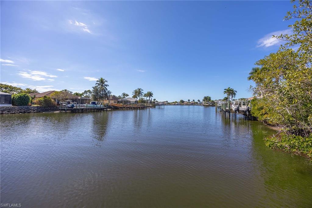 146 Windward Cay Naples, FL 34114 - Photo 5 of 33 a view of a lake with outdoor space