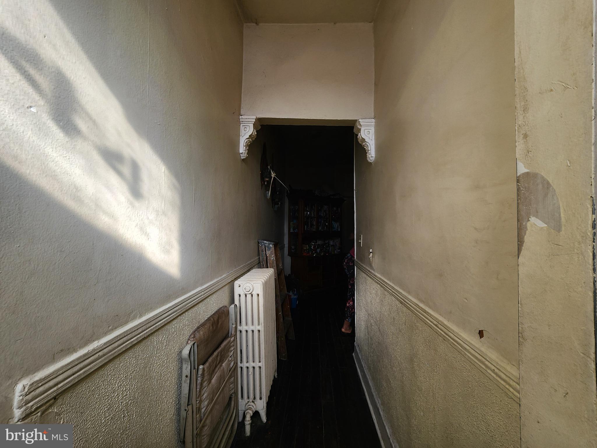 2744 Edmondson Avenue Baltimore, MD 21223 - Photo 4 of 17 a view of hallway with stairs