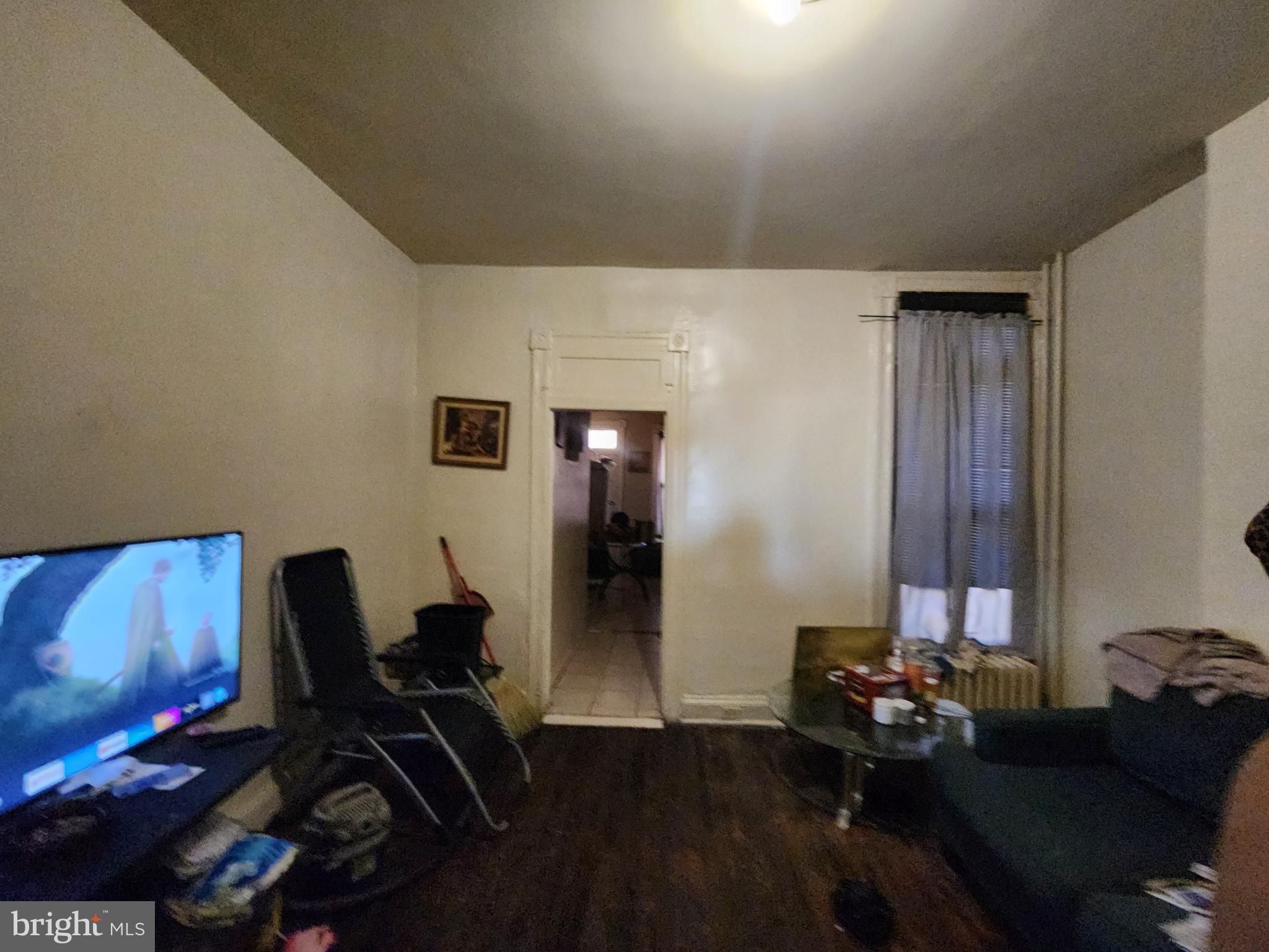 2744 Edmondson Avenue Baltimore, MD 21223 - Photo 9 of 17 a living room with furniture and wooden floor