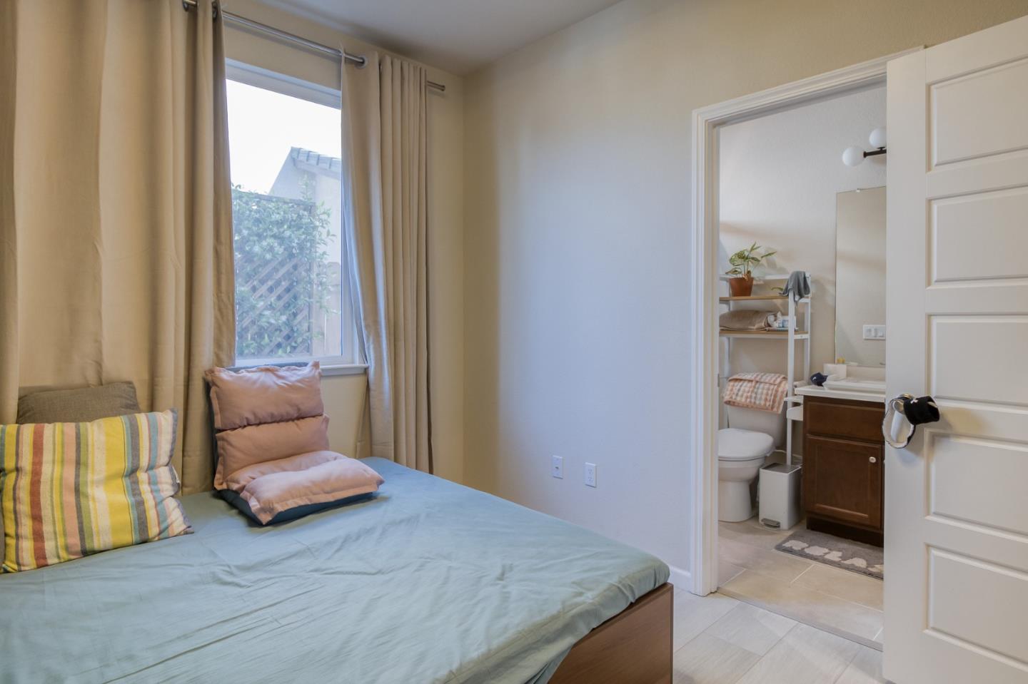 4341 Trailblazer Way Modesto, CA 95356 - Photo 24 of 27 a bedroom with a bed and a window