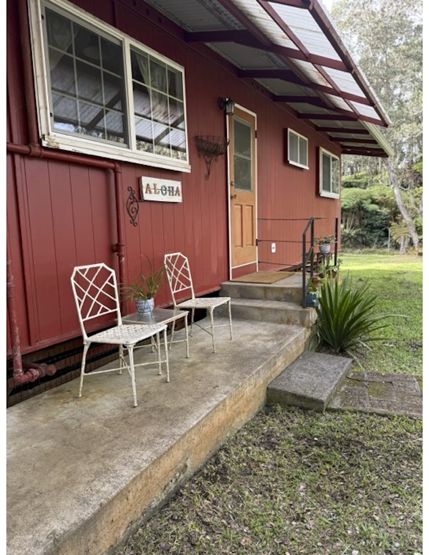 11-3972 Lanihuli Road Volcano, HI 96785 - Photo 6 of 21 a view of a backyard with table and chairs and potted plants