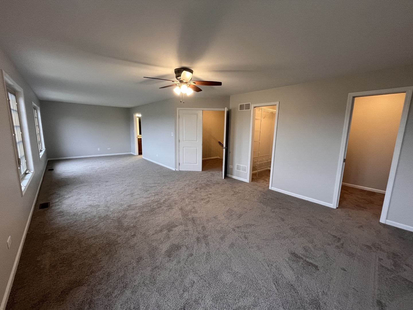 402 Chestnut Lane Beecher, IL 60401 - Photo 11 of 23 an empty room with windows and fan
