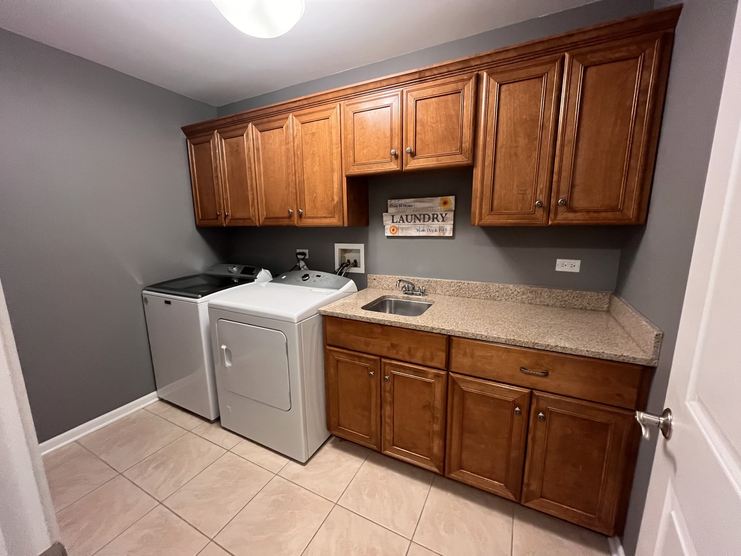 402 Chestnut Lane Beecher, IL 60401 - Photo 19 of 23 a utility room with granite countertop a sink a washer and dryer
