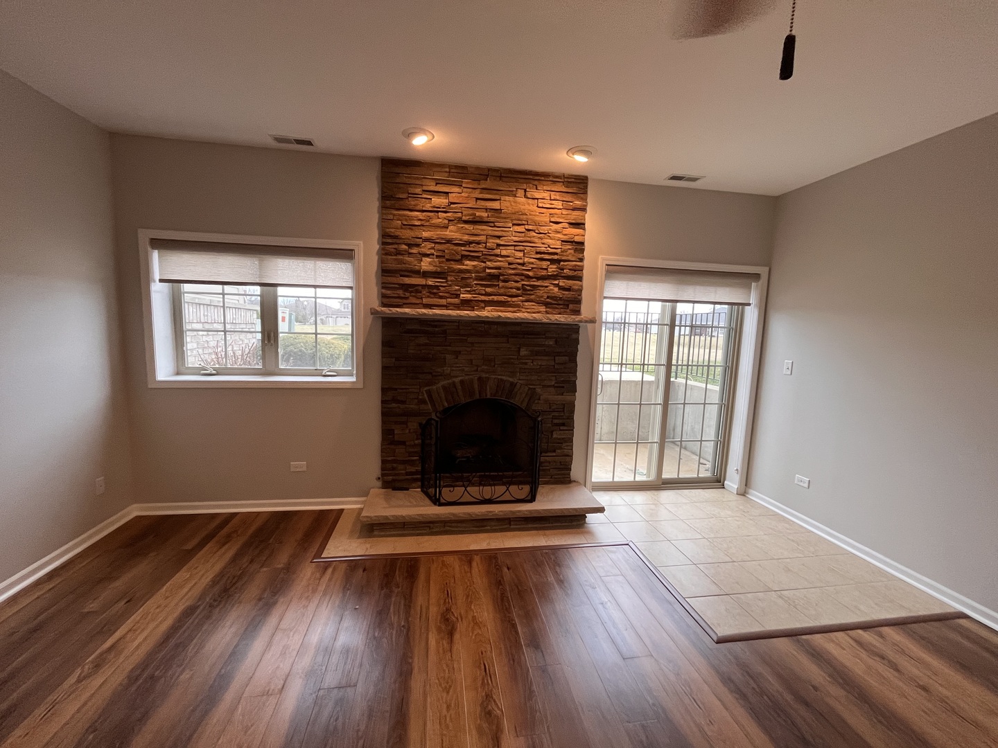402 Chestnut Lane Beecher, IL 60401 - Photo 5 of 23 a view of an empty room with wooden floor and a window