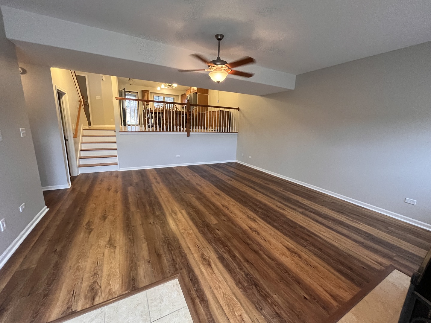 402 Chestnut Lane Beecher, IL 60401 - Photo 6 of 23 a view of empty room with wooden floor and fan