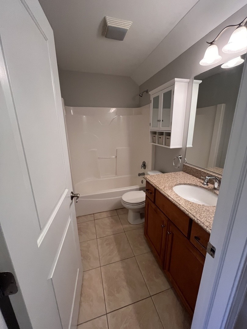 402 Chestnut Lane Beecher, IL 60401 - Photo 9 of 23 a bathroom with a granite countertop sink toilet and shower