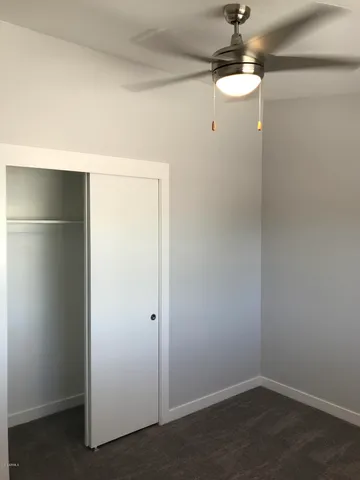 a view of a chandelier fan in a room
