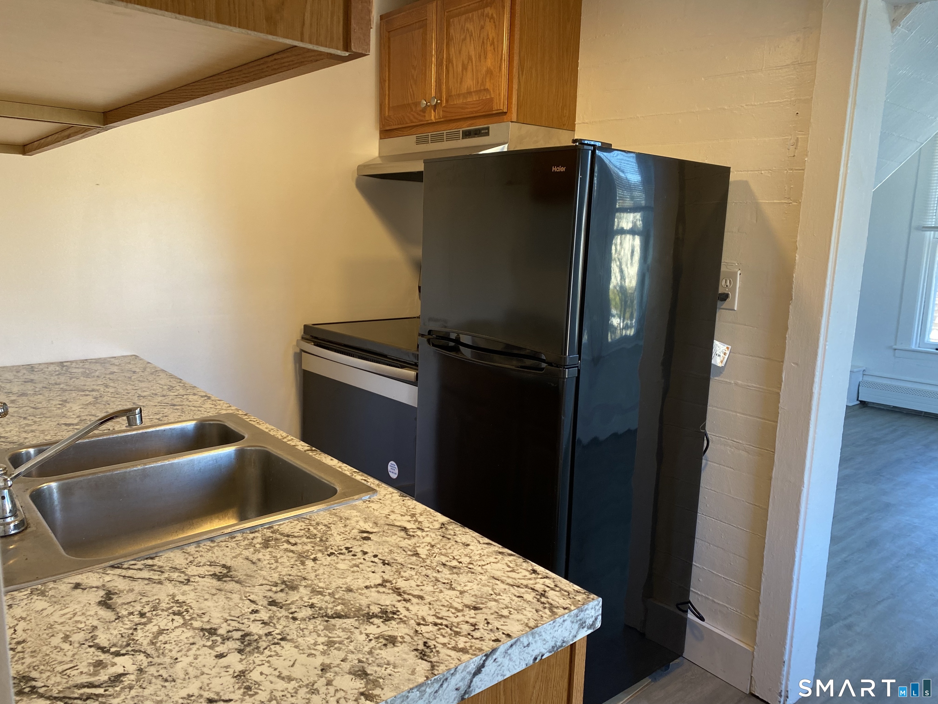 26 Prospect Street, Unit 9 New London, CT 06320 - Photo 6 of 12 a kitchen with a refrigerator and stove