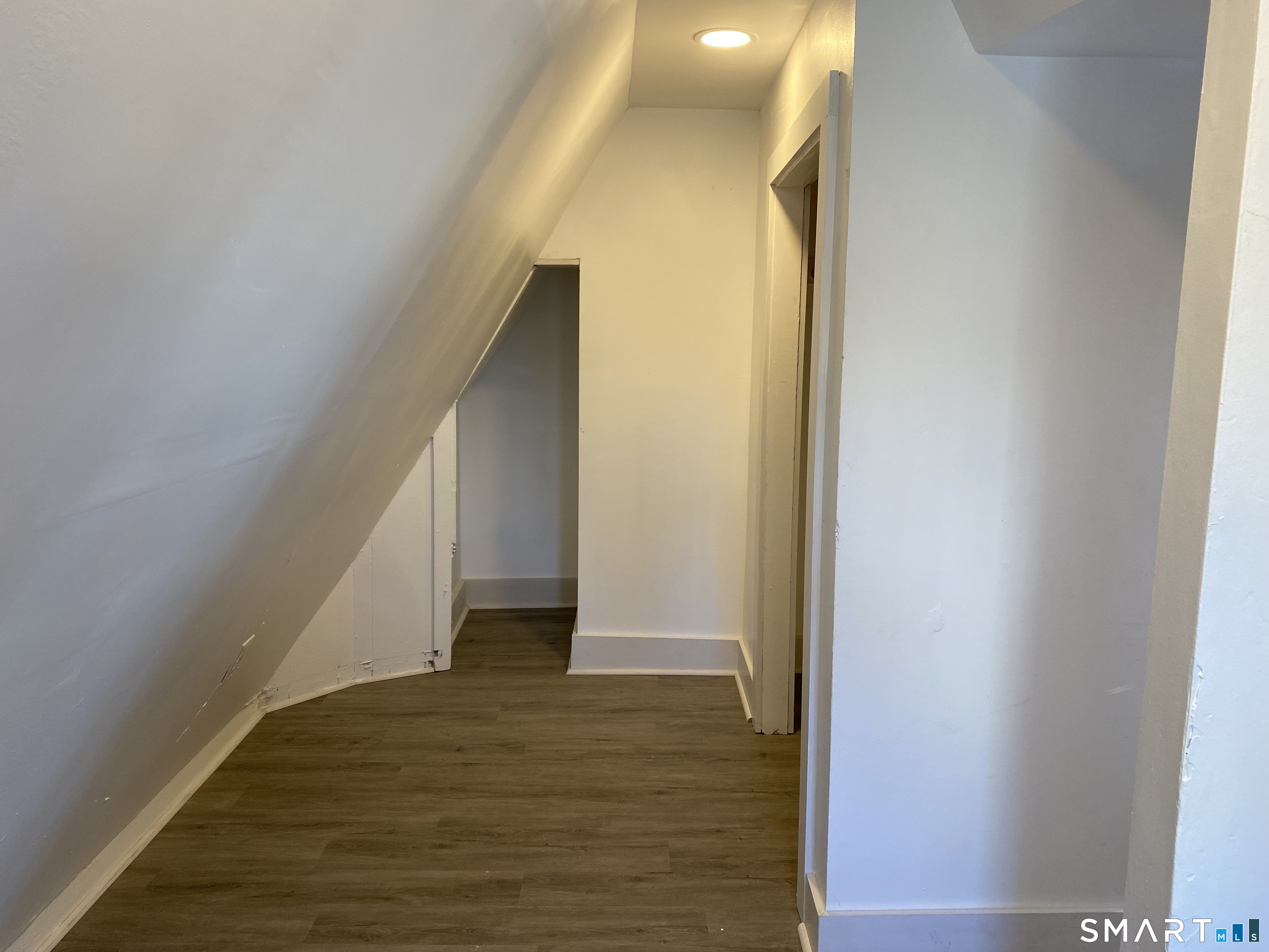 26 Prospect Street, Unit 9 New London, CT 06320 - Photo 9 of 12 a view of entryway and hall with wooden floor