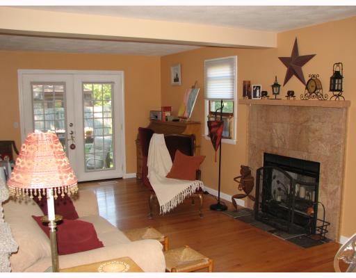 115 Ninigret Road Narragansett, RI 02882 - Photo 4 of 8 Den/Family/Great Room. HARDWOODS, FRENCH DOORS, & ROSE QUARTZ FIREPLACE MAKE THIS GREAT ROOM THE PERFECT PLACE TO GATHER.