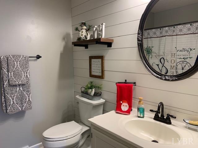 203 Kimball Road Concord, VA 24538 - Photo 12 of 27 a bathroom with a sink mirror vanity and toilet