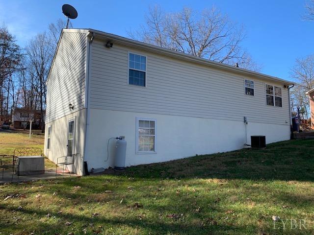 203 Kimball Road Concord, VA 24538 - Photo 24 of 27 a view of a backyard with plants and large tree