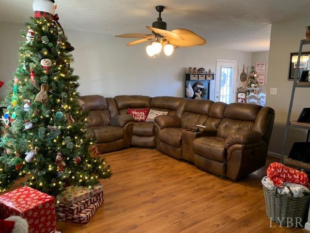 203 Kimball Road Concord, VA 24538 - Photo 4 of 27 a living room with furniture flowers and a chandelier