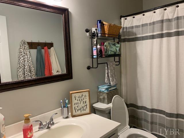 203 Kimball Road Concord, VA 24538 - Photo 10 of 27 a bathroom with a sink toilet and shower