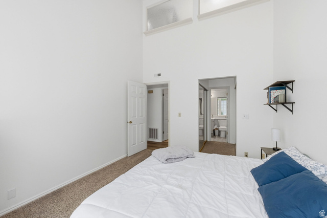 650 South Main Street, Unit 3304 Bountiful, UT 84010 - Photo 10 of 22 Vaulted ceilings with high transom windows enhance this bedroom space