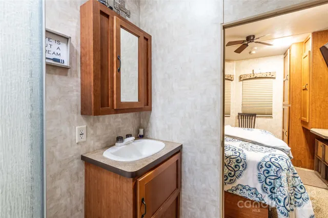a bathroom with a sink and a mirror