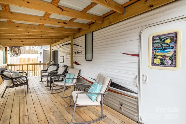 a view of living room kitchen with furniture and outdoor seating