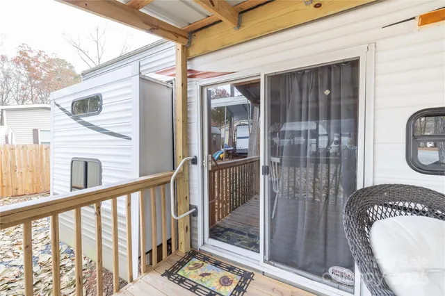 a house view with a wooden fence