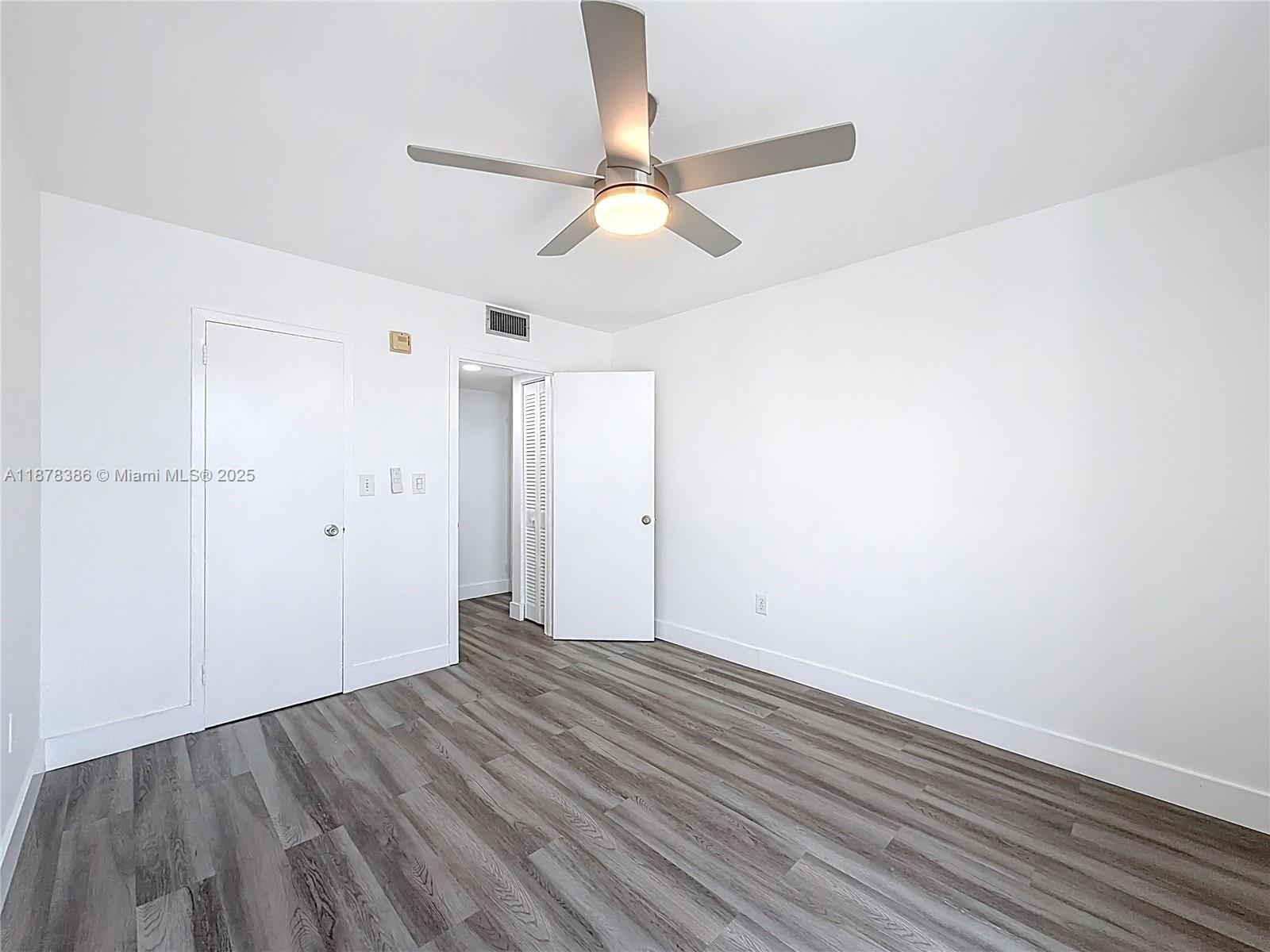 17620 Atlantic Boulevard, Unit 505 Sunny Isles Beach, FL 33160 - Photo 24 of 35 wooden floor in an empty room